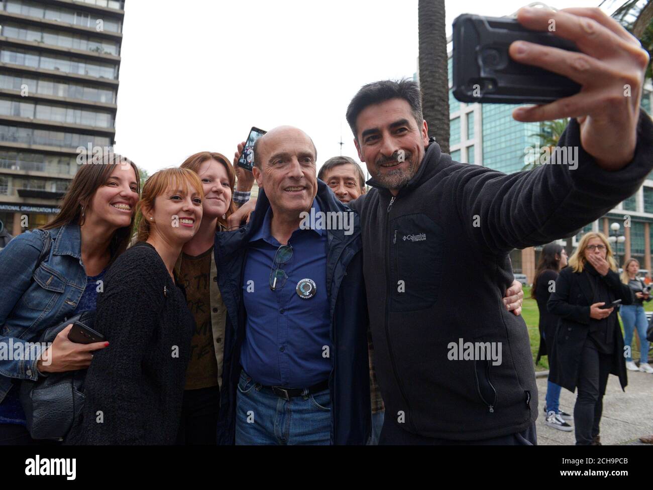Daniel Martinez (C), presidential candidate of the ruling Broad Front party, poses for a photograph with supporters, during a protest against feticide and violence women, in Montevideo, Uruguay November 25, 2019. REUTERS/ Andres Cuenca Olaondo Stock Photo