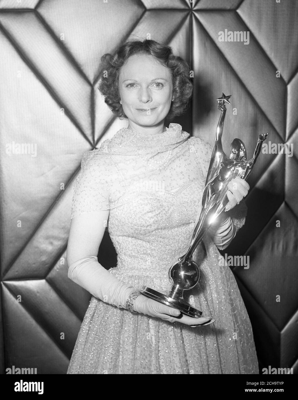 Voted Britain's top film actress, Anna Neagle holds her Silver Star after the presentation of the Daily Mail National Film Awards at the Dorchester Hotel, Park Lane. Anne easily led a nationwide poll for her work in Odette. Stock Photo