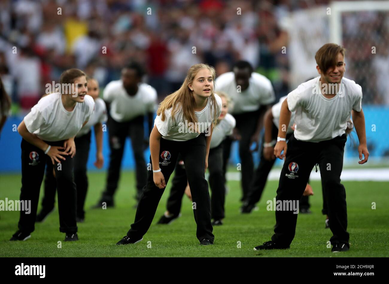 Dancers on the pitch before kickoff Stock Photo Alamy