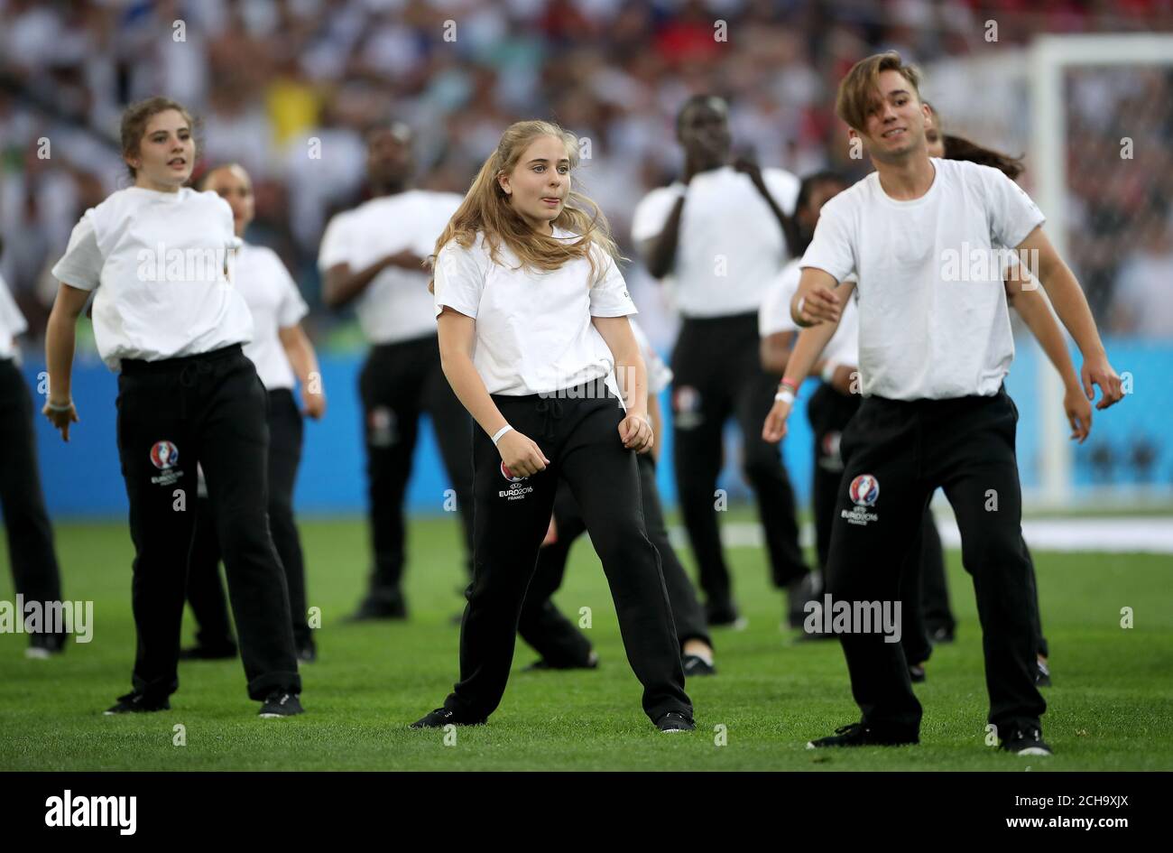 Dancers on the pitch before kickoff Stock Photo Alamy