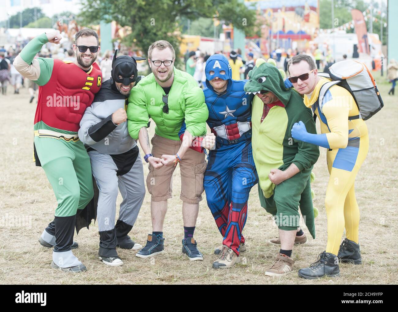 Festivalgoers dressed in superhero fancy dress at the Isle of Wight Festival, Seaclose park, Newport, on the Isle of Wight. Stock Photo