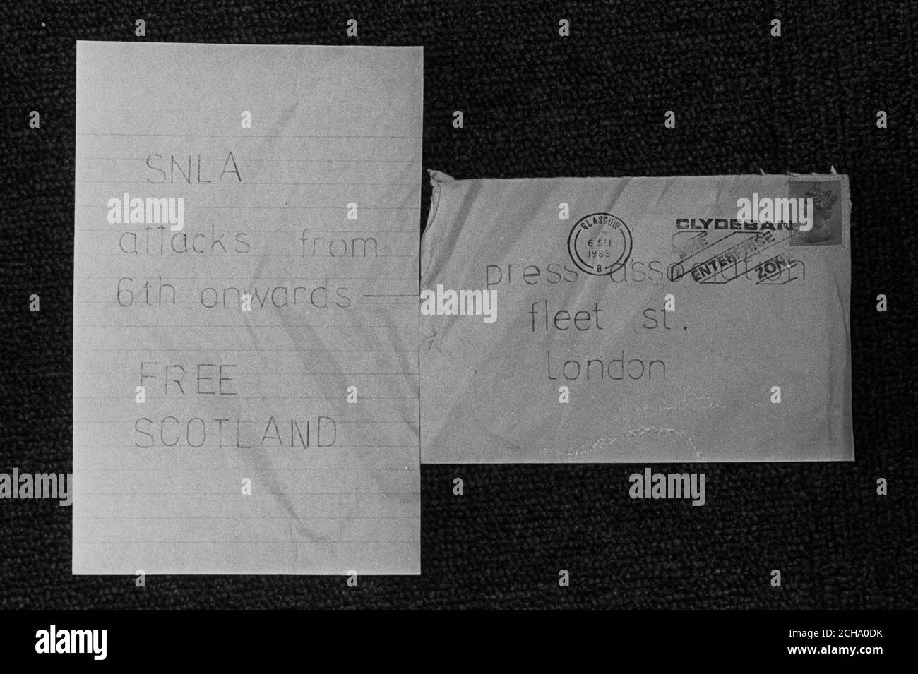 A letter and its envelope sent from the Scottish National Liberation Army to the London offices of the Press Association, the day after two letter bombs were found in London. The letter, bearing a second class stamp, was posted in Glasgow (Sept 6th) and warned of 'SNLA attacks from the 6th onwards - Free Scotland'. Stock Photo