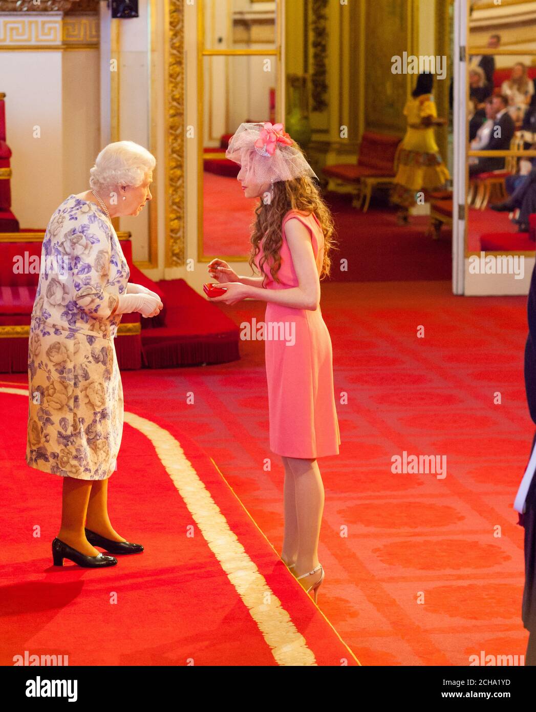 Ms. Kelly Lovell from Canada receives a medal from Queen Elizabeth II during the Queen's Young Leaders Awards 2016 at Buckingham Palace, London. PRESS ASSOCIATION Photo. Picture date: Thursday June 23, 2016. Photo credit should read: Dominic Lipinski/PA Wire Stock Photo