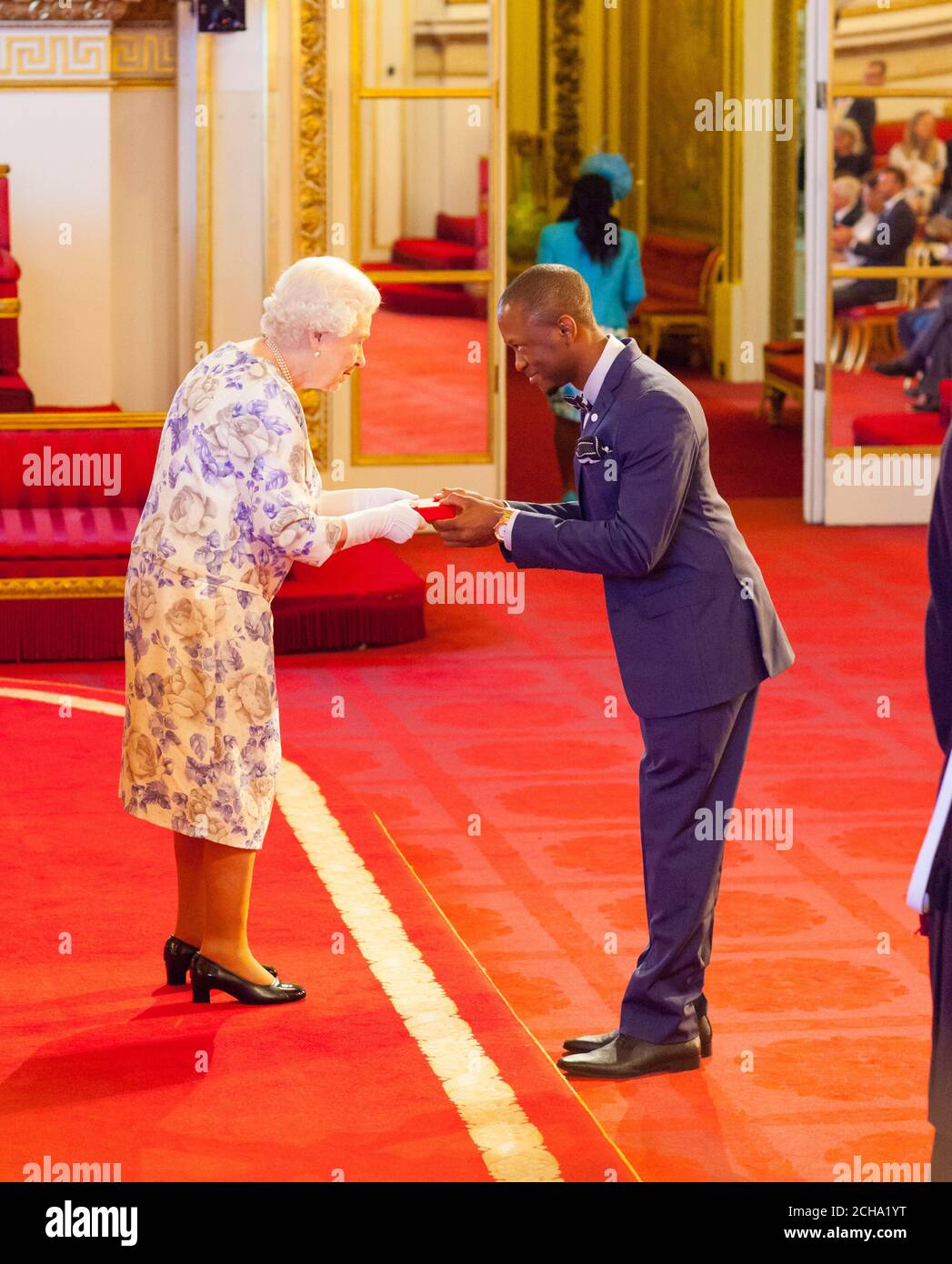 Dr. Howard Nelson-Williams from Sierra Leone receives a medal from Queen  Elizabeth II during the Queen's Young Leaders Awards 2016 at Buckingham  Palace, London. PRESS ASSOCIATION Photo. Picture date: Thursday June 23,