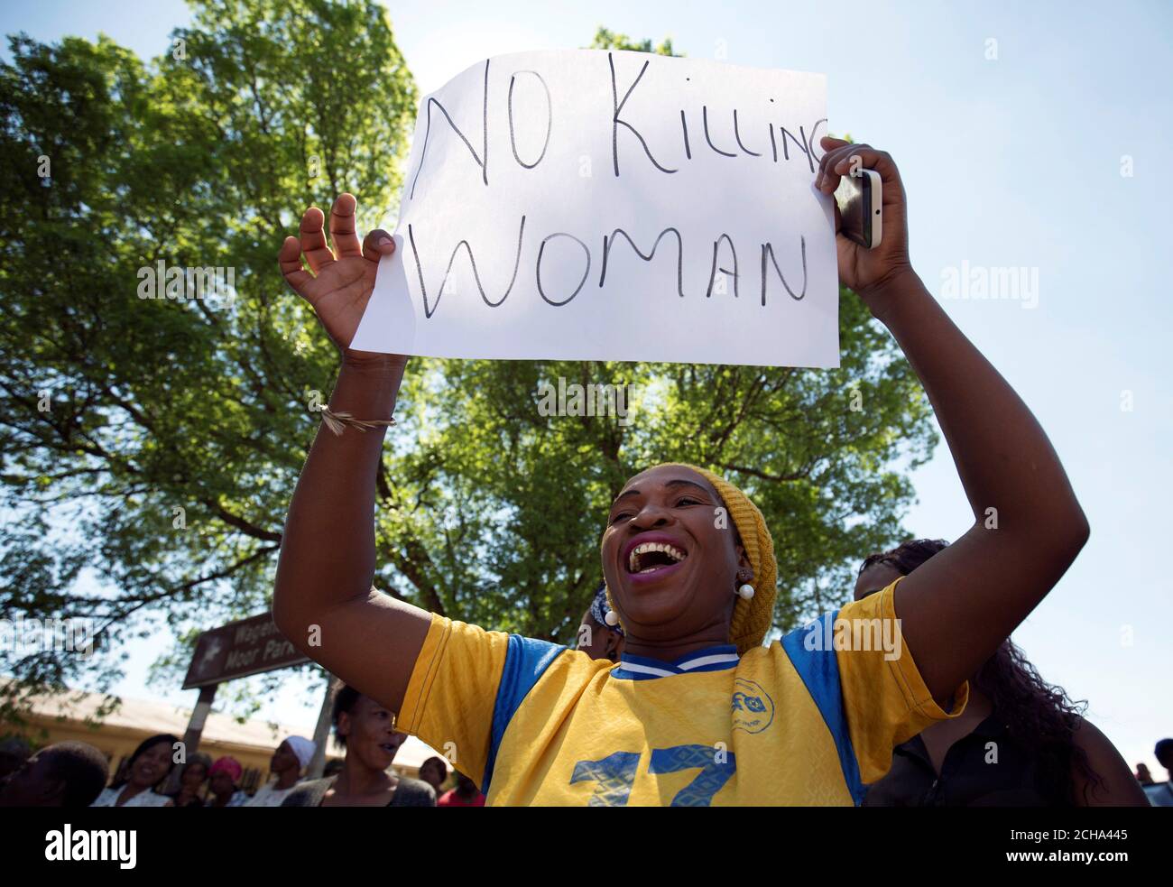 A Woman Protests Before Men Accused Of Cannibalism Appear In Court 