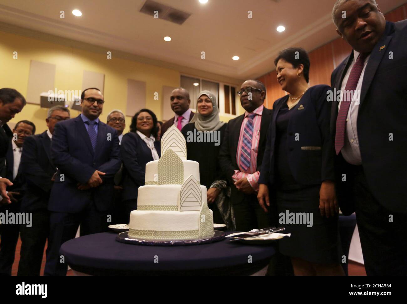 ICD Director of Advisory Services Nida Riza (4th R), Governor of Suriname's  Central Bank Glenn Gersie (3rd R), CEO of Trustbank Amanah Maureen Badjoeri  (2nd R) and board members attend the launch