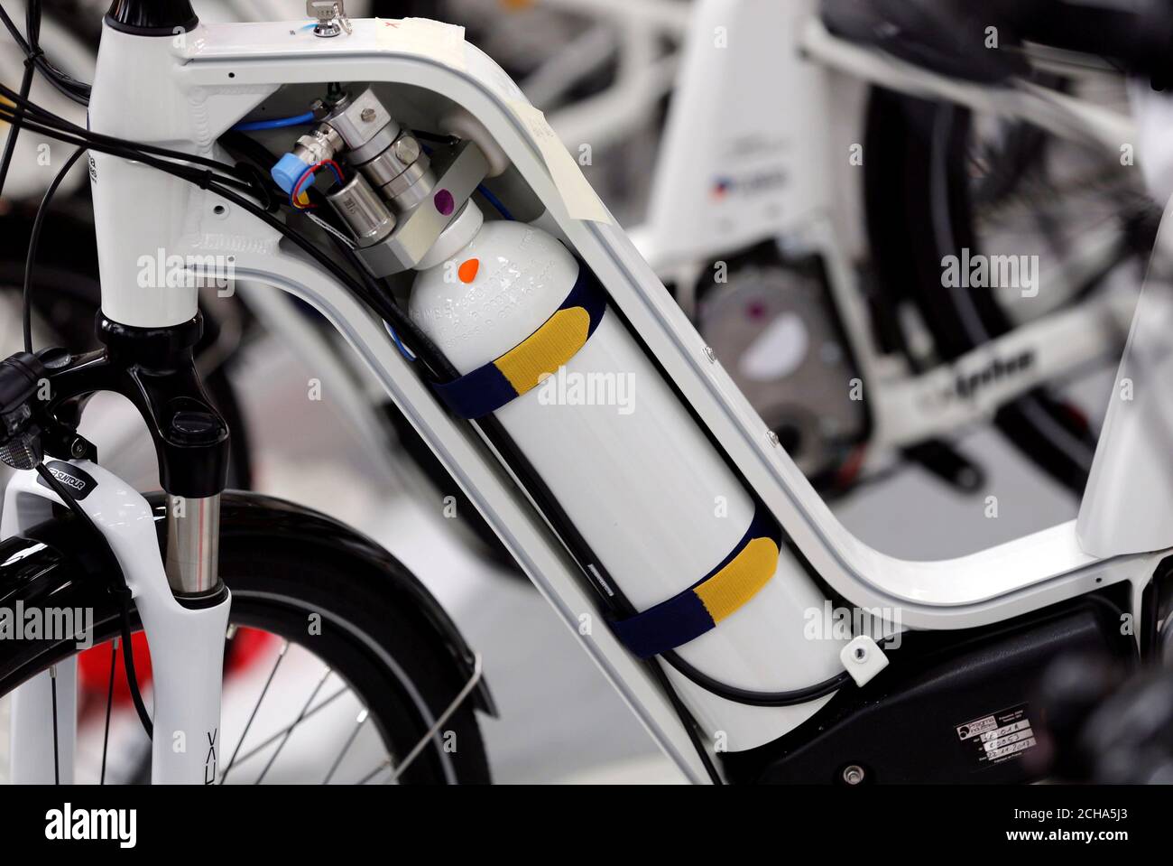 An Alpha bike, the first industrialised bicycle to use a hydrogen fuel  cell, is displayed at