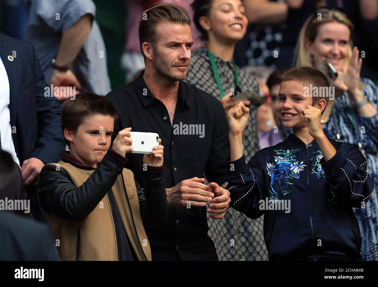 David Beckham and his sons Romeo and Cruz on day nine of the Wimbledon