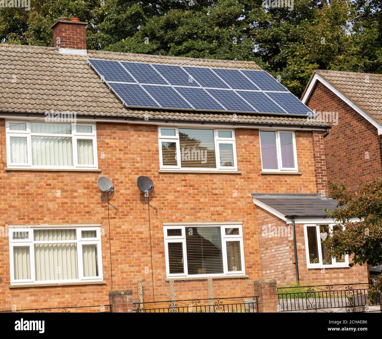 Solar panels of roof of semi-detached modern house in Ipswich, Suffolk, England, UK Stock Photo