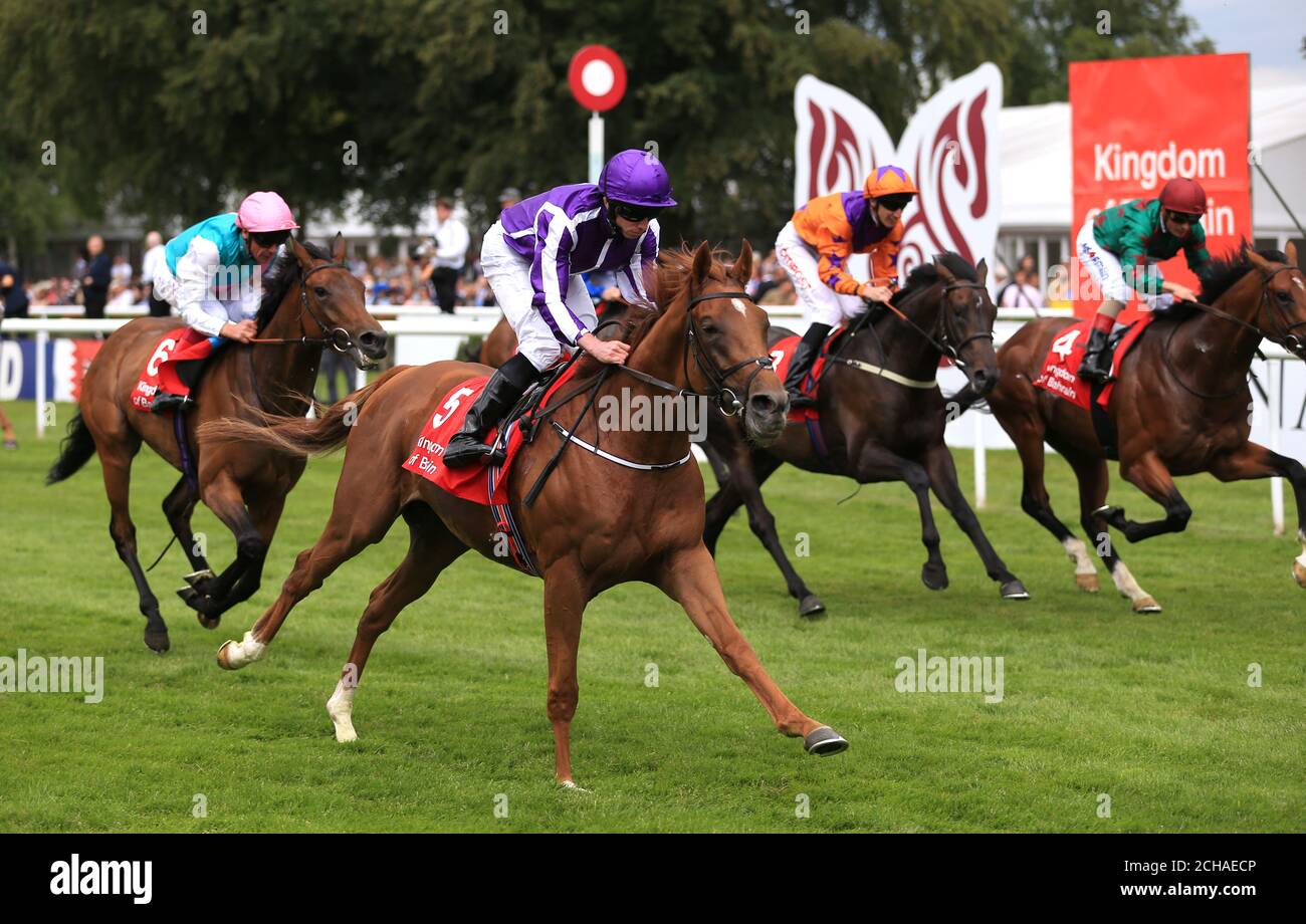 Housesofparliament (centre) ridden by Ryan Moore wins The Bahrain Trophy during Ladies Day of The Moet & Chandon July Festival at Newmarket Racecourse. Stock Photo