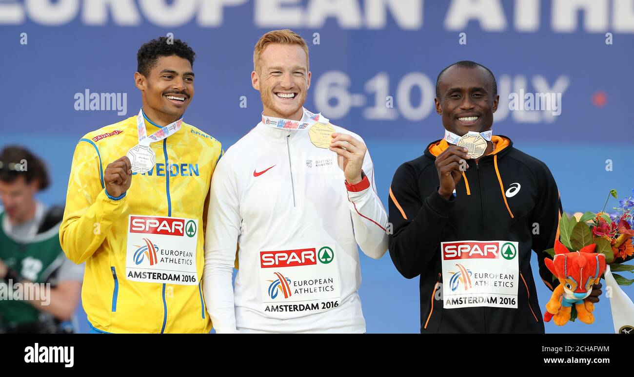 Greg Rutherford Podium Great Britian's Greg Rutherford (centre) on the podium with his gold ...