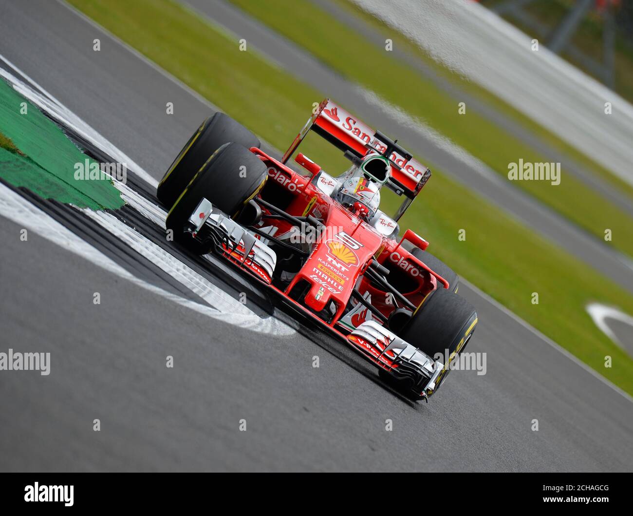 Ferrari's Sebastian Vettel during Practice Day for the 2016 British Grand Prix at Silverstone Circuit, Towcester. PRESS ASSOCIATION Photo. Picture date: Friday July 8, 2016. See PA story AUTO British. Photo credit should read: Tony Marshall/PA Wire. RESTRICTIONS: Editorial use only. Commercial use with prior consent from teams. Call +44 (0)1158 447447 for further information. Stock Photo