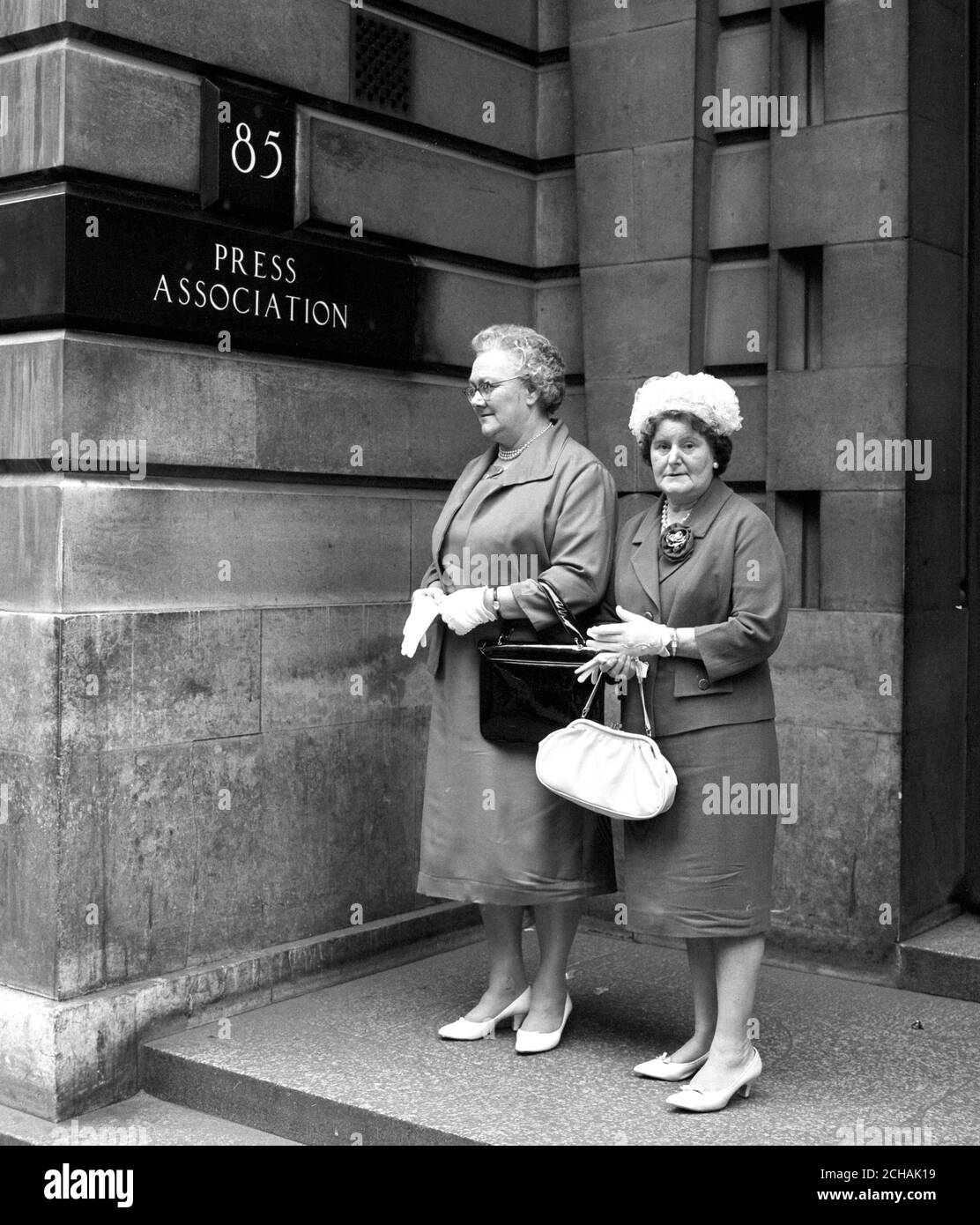 Press Association cleaners Mrs Twigg (left), and Mrs Whiterod, who had invitations to attend a reception for about 400 of the City's female cleaners in Mansion House. The reception, in connection with the City of London Festival, was given by the Lord Mayor and his wife because they felt that some tribute ought to be paid to those who keep the City and its offices clean. Stock Photo