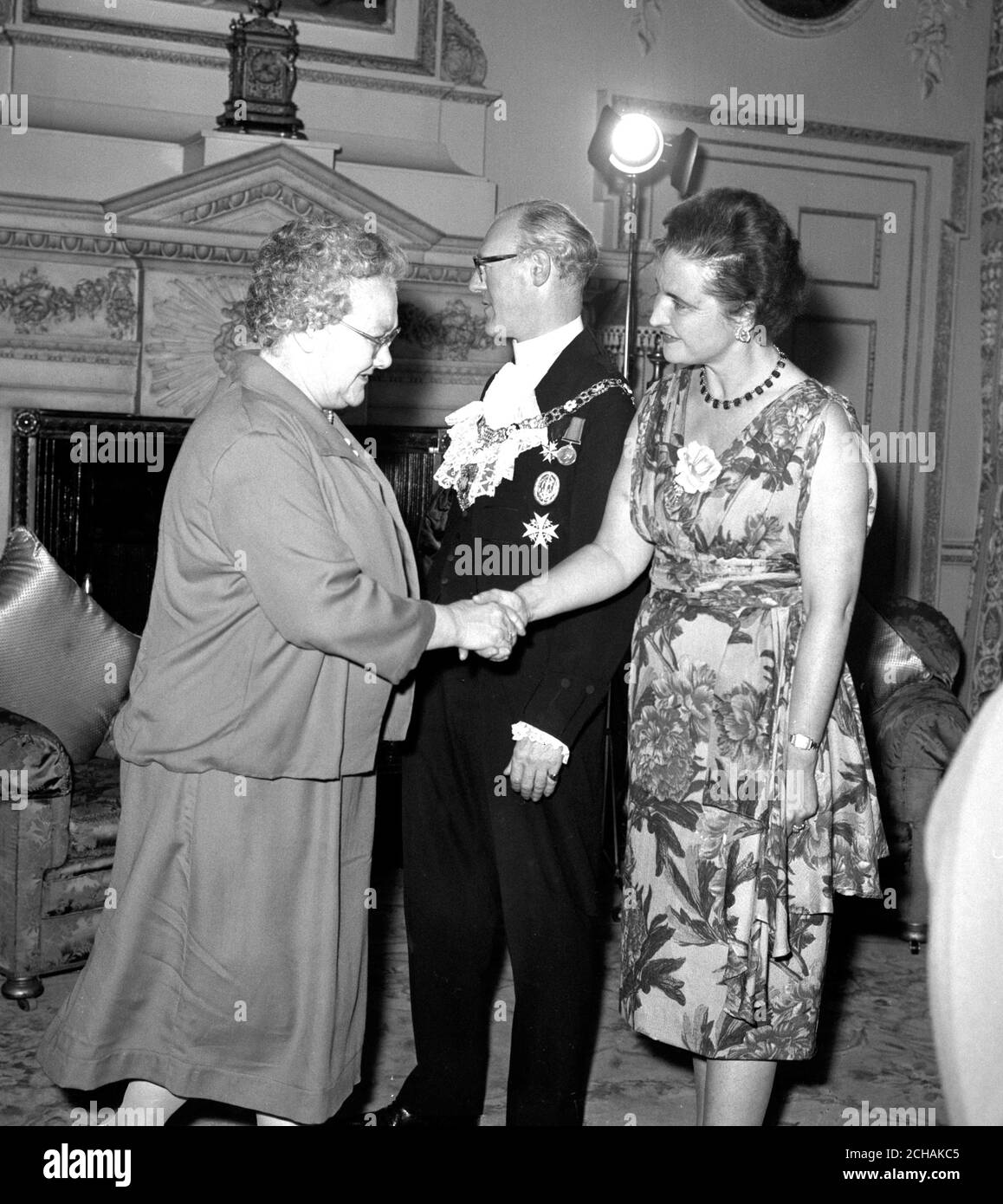 Press Association cleaner Mrs Twigg meets the Lord Mayor of London Sir Frederick Hoare and the Lady Mayoress at a reception for about 400 of the City's female cleaners at Mansion House. The reception, in connection with the City of London Festival, was given by the Lord Mayor and his wife because they felt that some tribute ought to be paid to those who keep the City and its offices clean. Stock Photo