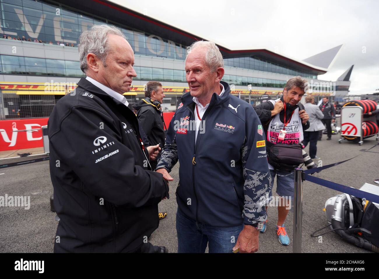 Jerome Stoll Renault Sport F1 President on the grid with Dr Helmut Marko Red Bull Motorsport Consultant. during the 2016 British Grand Prix at Silverstone Circuit, Towcester. Stock Photo