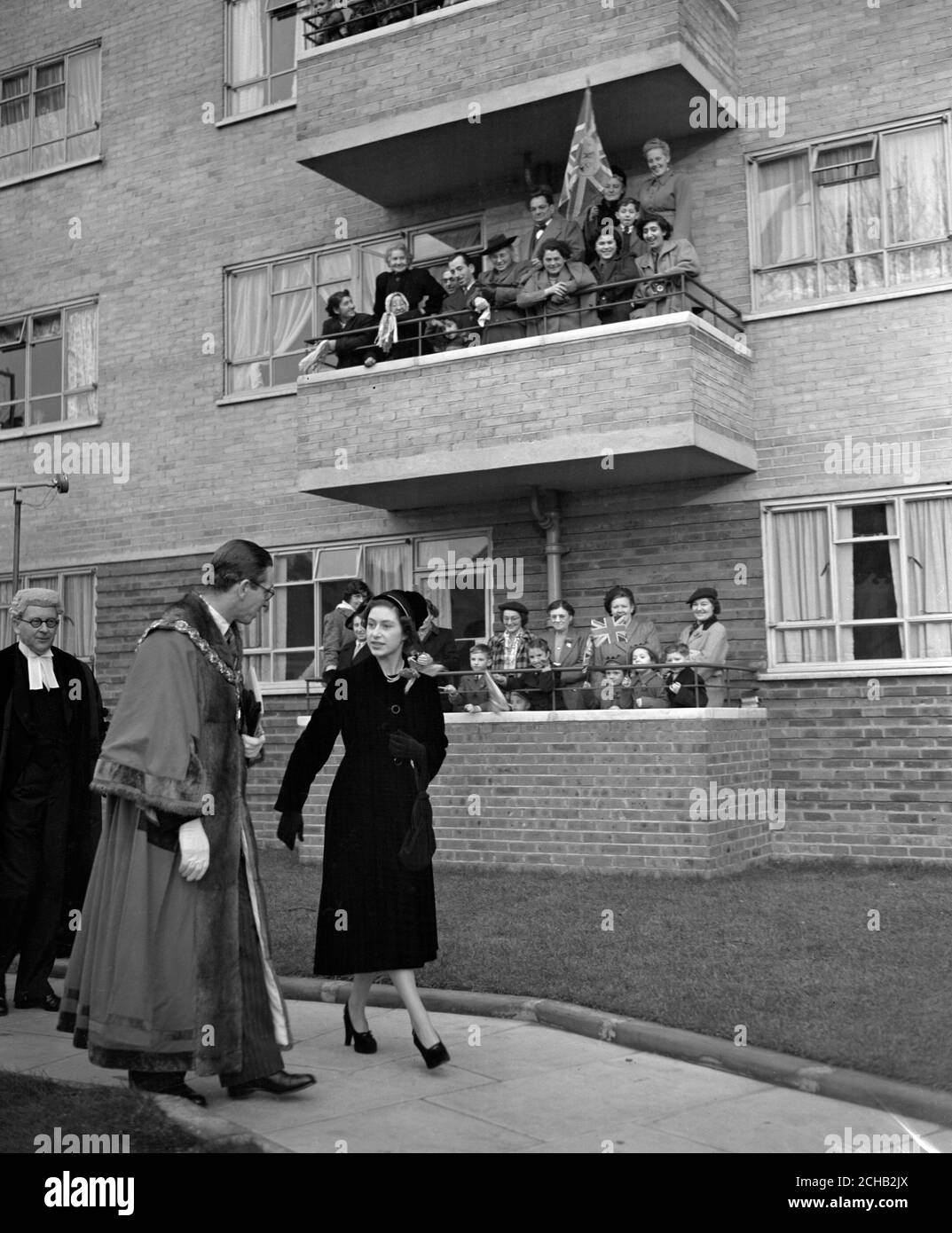 Residents get a close-up view of Princess Margaret from balconies of Amwell Court in Green Lanes, London, during her visit to the new block of council flats which the princess opened. Stock Photo