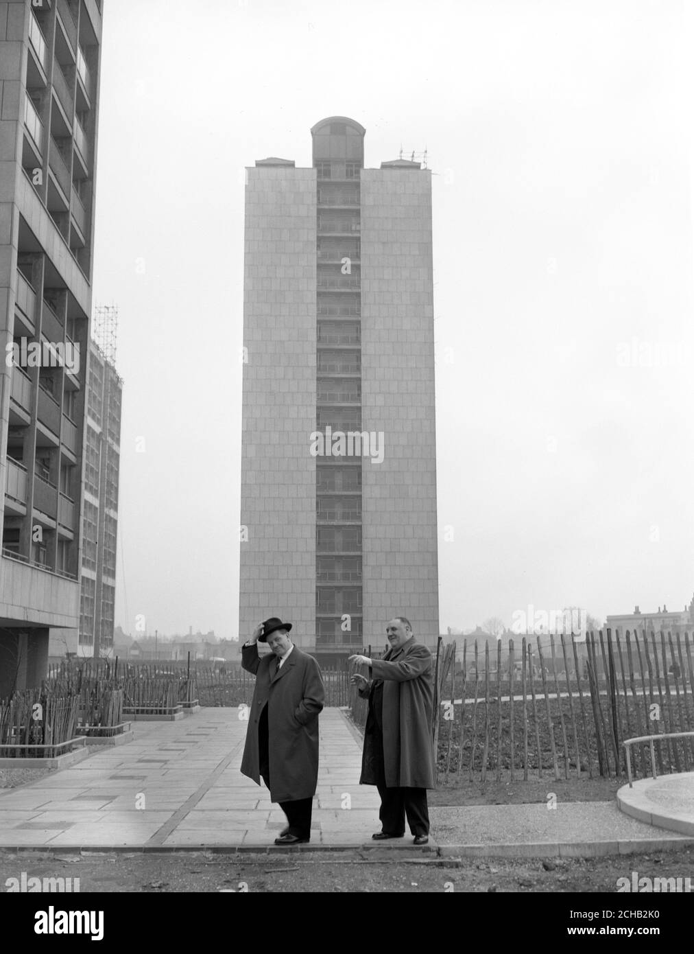 Herr Paul Lucke (l), the Federal German Minister of Housing, with E.E. Woods, vice-chairman of the London County Council, when he visited Cornish House, a newly-completed 18-storey block of three-room flats in Southwark, London. Stock Photo