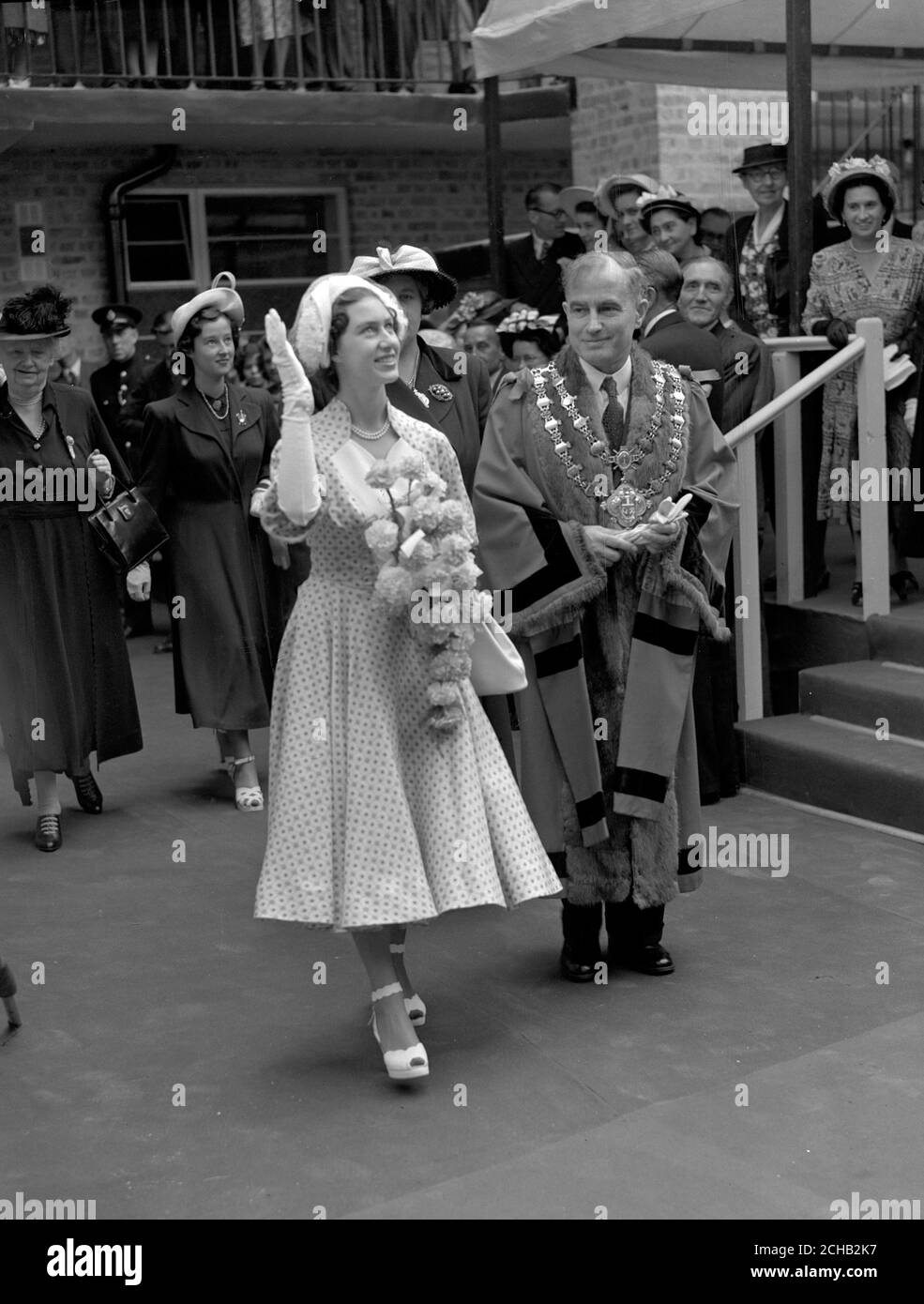 Princess Margaret waving to onlookers as she leaves after opening the new Islington estate in London. Alongside her is Mayor of Islington Ald. H.J.L. Lygoe. Stock Photo