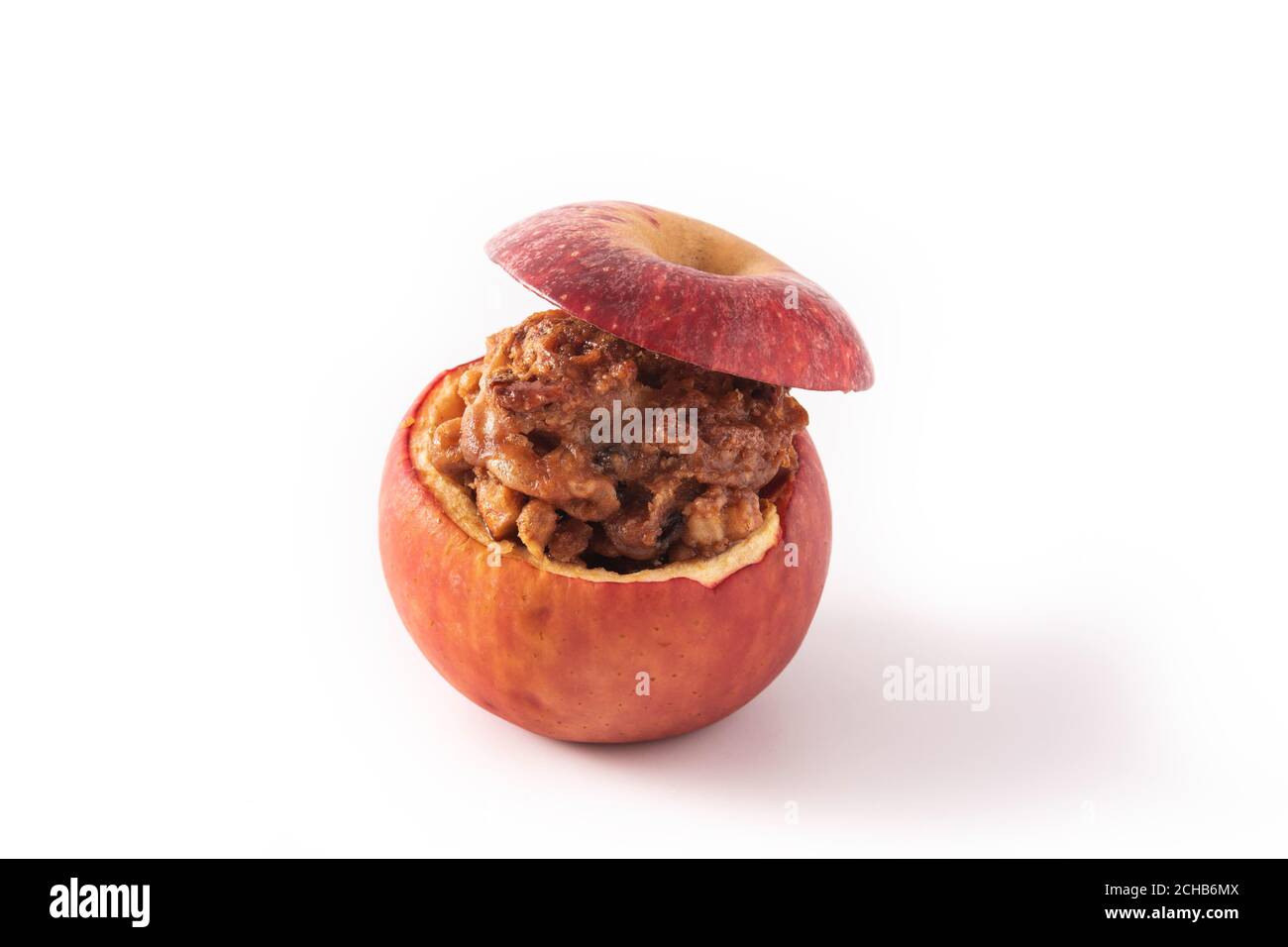 Stuffed apples baked with nuts isolated on white background Stock Photo