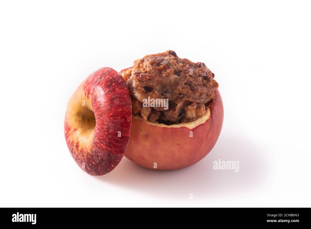 Stuffed apples baked with nuts isolated on white background Stock Photo