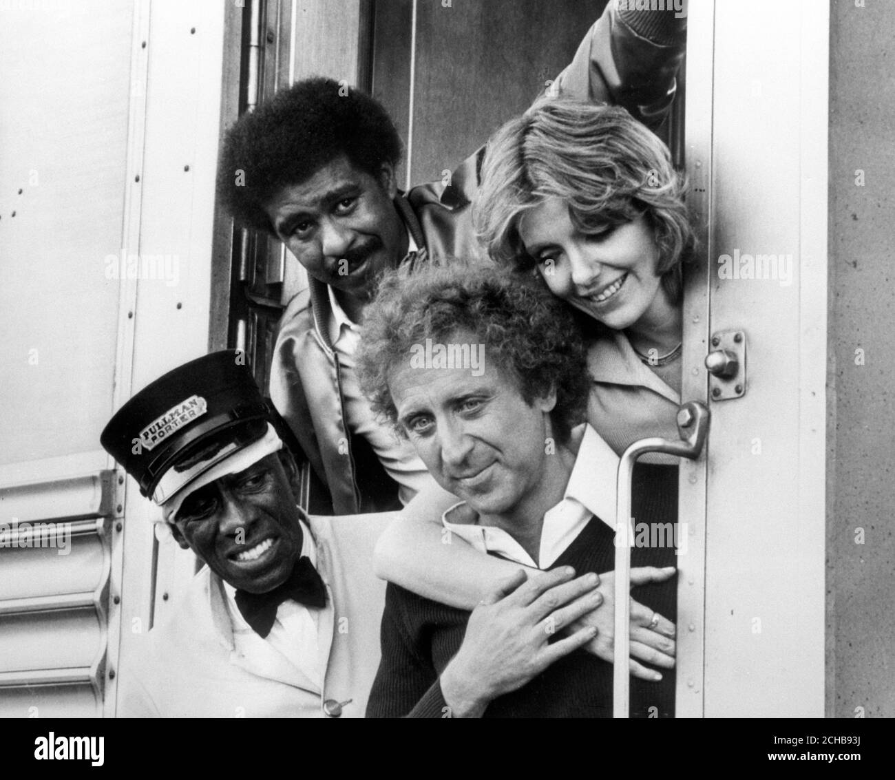 Riding the rails on a mad adventure in 'Silver Streak' are (l-r) Scatman Crothers, Richard Pryor, Gene Wilder and Jill Clayburgh in a comedy set aboard a luxury train between Los Angeles and Chicago. Stock Photo