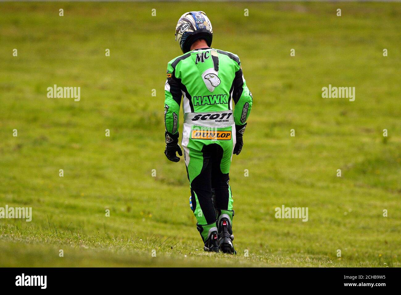 Kawasaki rider John McGuinness after crashing during the British Superbike Championship at Knockhill Race Circuit, Fife, Scotland. Stock Photo