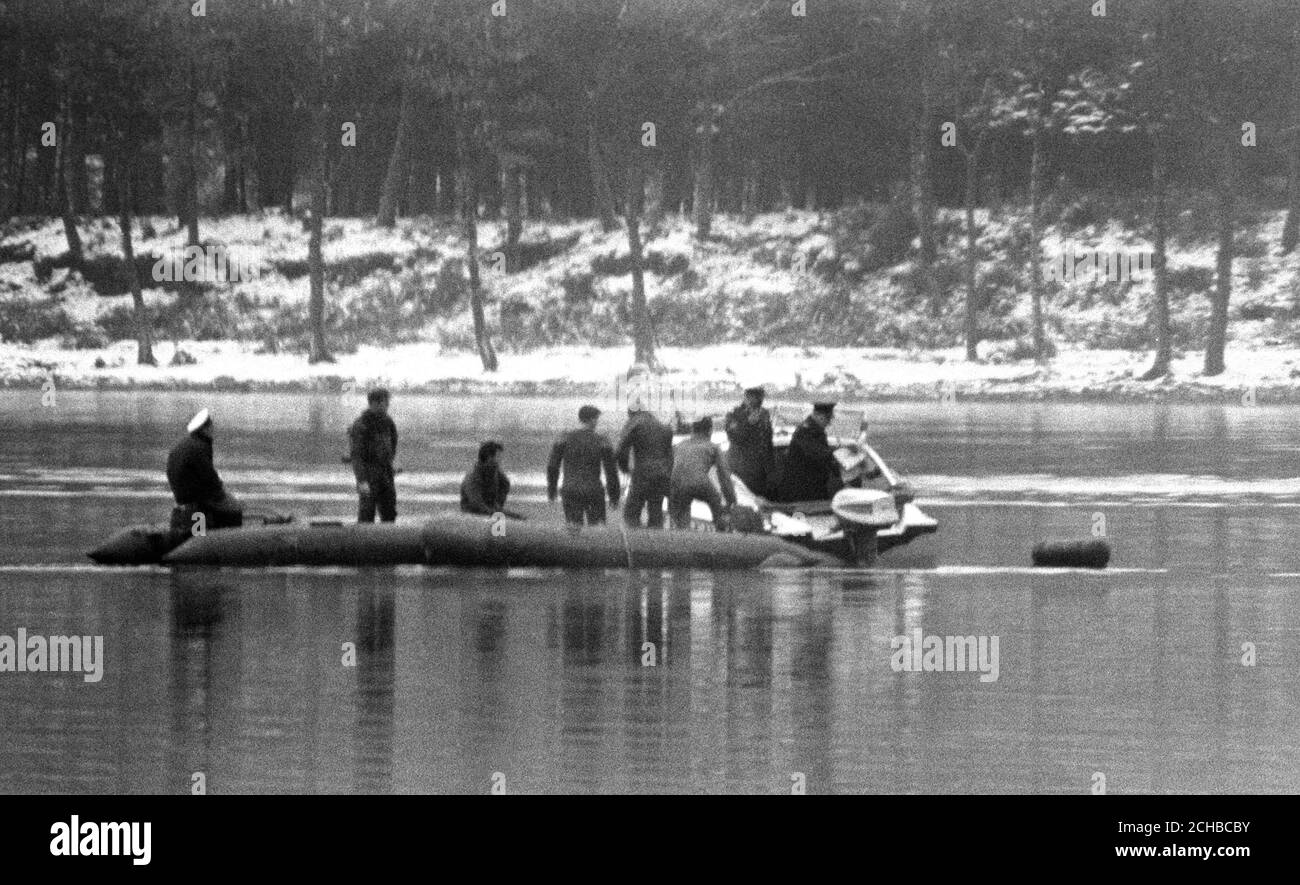 Amid bleak surroundings, Royal Navy divers continue their search for the wreckage of Donald Campbell's Bluebird at Lake Coniston. Today they found a section of the steering mechanism. Stock Photo