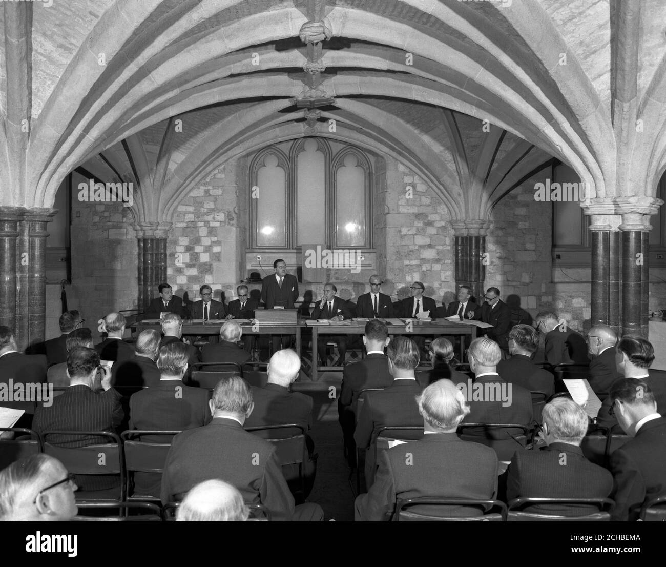 An historic setting - the Crypt beneath the Guildhall, London, for the 100th annual general meeting of the Press Association, Britain's national news agency, which is celebrating its centenary. The chairman of PA, W.D. Barnetson, is seen addressing the meeting. Stock Photo