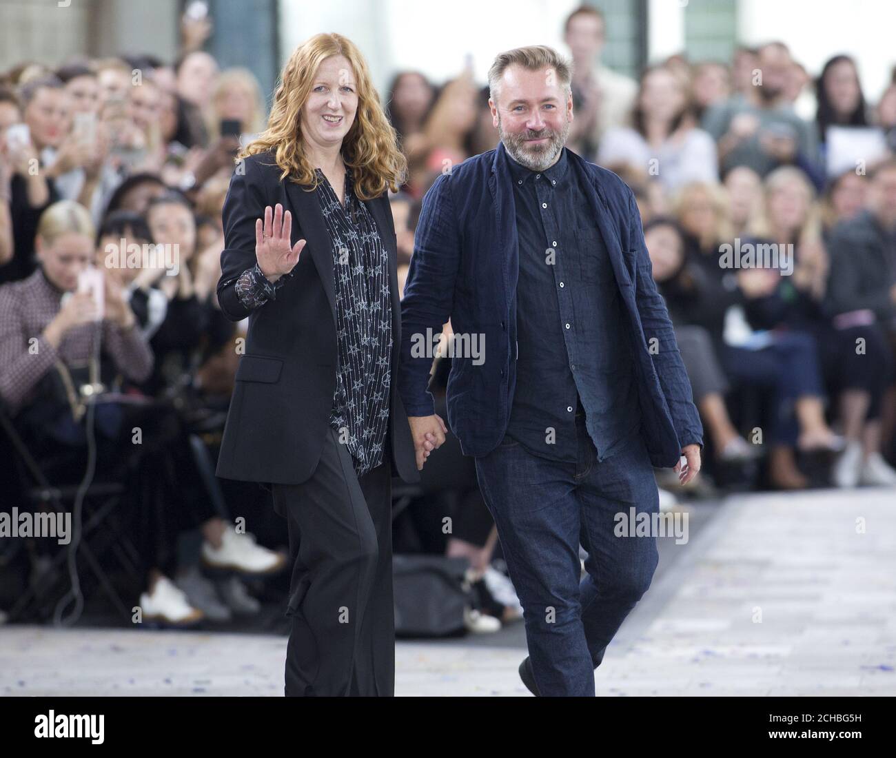 Designers Justin Thornton (R) and Thea Bregazzi greet the public after presenting Preen by Thornton Bregazzi Spring/ Summer 2017 London Fashion Week show at Queen Elizabeth II Centre, London. PRESS ASSOCIATION Photo. Picture date: Sunday September 18, 2016. See PA story CONSUMER Fashion. Photo credit should read: Isabel Infantes /PA Wire Stock Photo