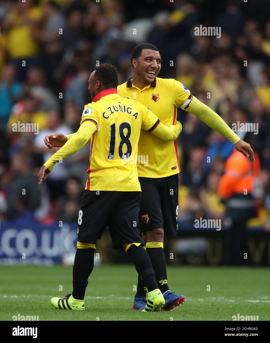 Watford's Juan Camilo Zuniga (left) and Troy Deeney celebrate victory after the final whistle  Stock Photo