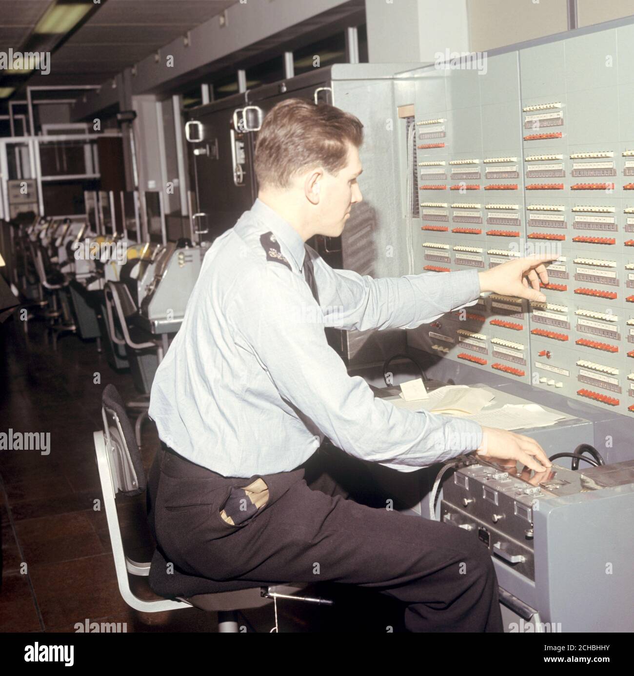 Broadcast console in the tape relay centre at the new headquarters of the Metropolitan Police at New Scotland Yard, London. Stock Photo