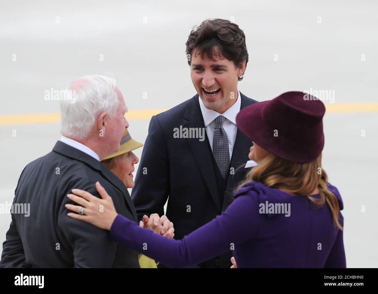 L-r Governor General of Canada David Johnston and his wife Sharon with Canadian Prime Minister Justine Trudeau(facing camera) with his wife Sophie Gregoire Trudeau as they await the arrival of the plane carrying The Duke and Duchess of Cambridge at Victoria International Airport on the first day of the Royal Tour to Canada. PRESS ASSOCIATION Photo. Picture date: Saturday September 24, 2016. See PA story ROYAL Canada. Photo credit should read: Andrew Milligan/PA Wire Stock Photo
