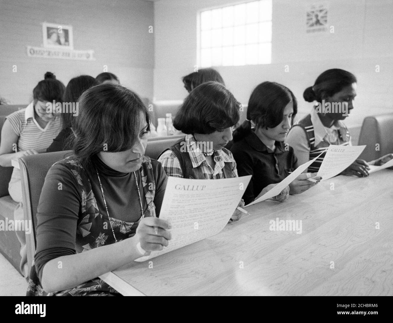 Non-striking workers at the Grunwick film processing plant in Willesden, north London, studying their voting papers in a secret ballot conducted by the Gallup Poll and which resulted in 87 per cent rejection of the voters said they did not wish to be members of APEX. Stock Photo