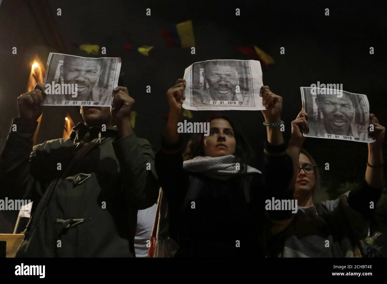 People hold posters with the photograph of Temistocles Machado, Colombian social leader killed, during protest against the killing of social activists, in Bogota, Colombia July 26, 2019. Picture taken July 26, 2019. REUTERS/Luisa Gonzalez Stock Photo