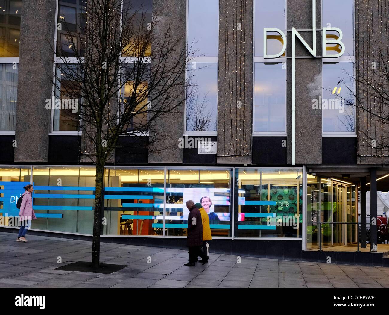 People walk past DNB bank branch in Stavanger, Norway December 5, 2019.  REUTERS/Ints Kalnins Stock Photo - Alamy