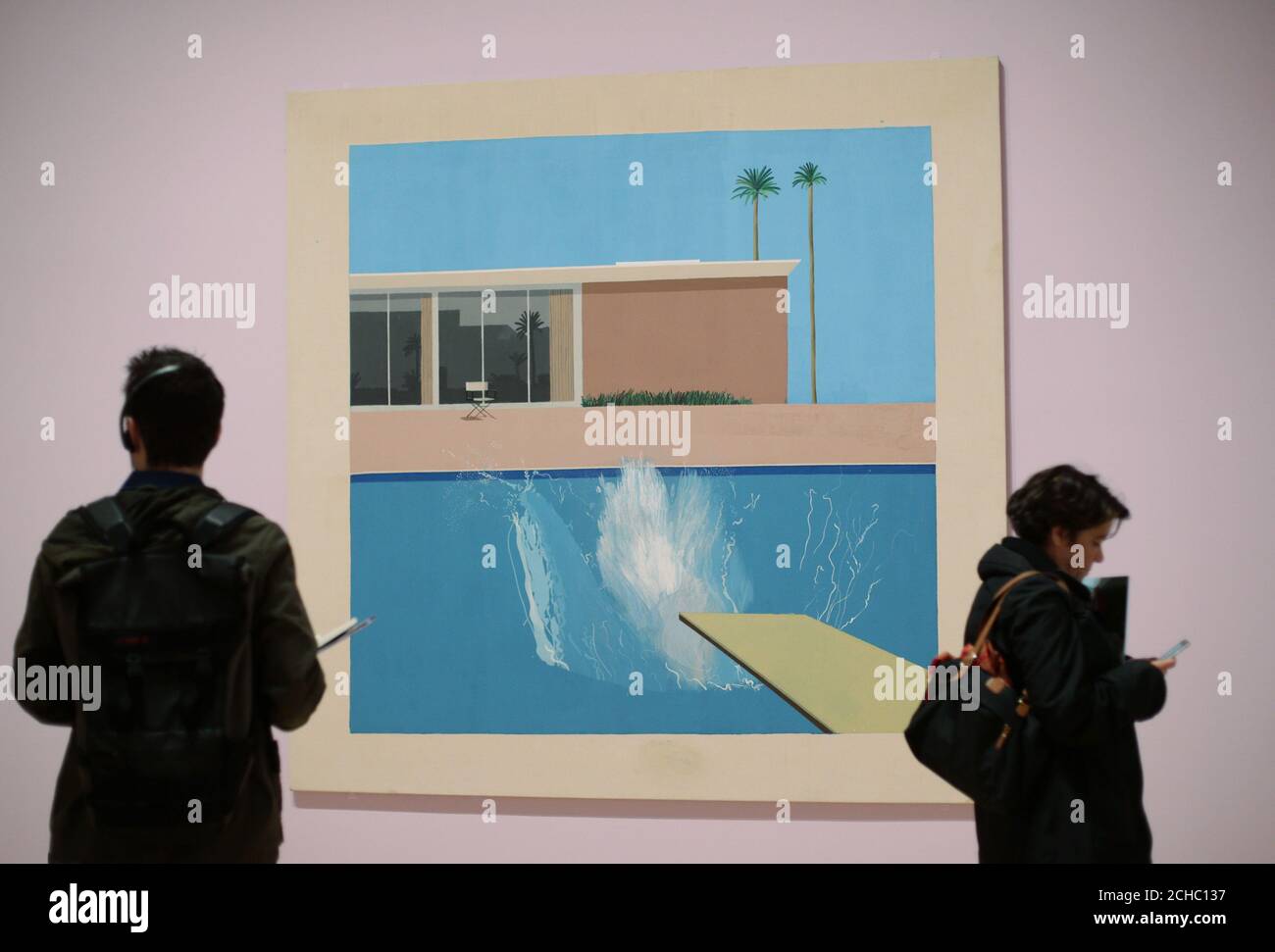 Visitors standing next to A bigger splash, 1967, as part of the David