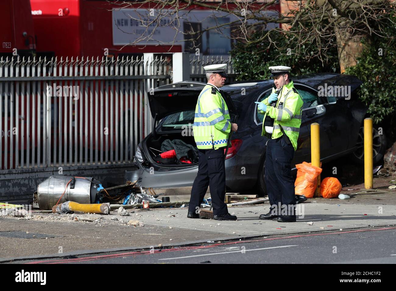 Police at the scene at Bromley Road in Bellingham, where five people have been left in hospital after they were run over by a car in London. Stock Photo