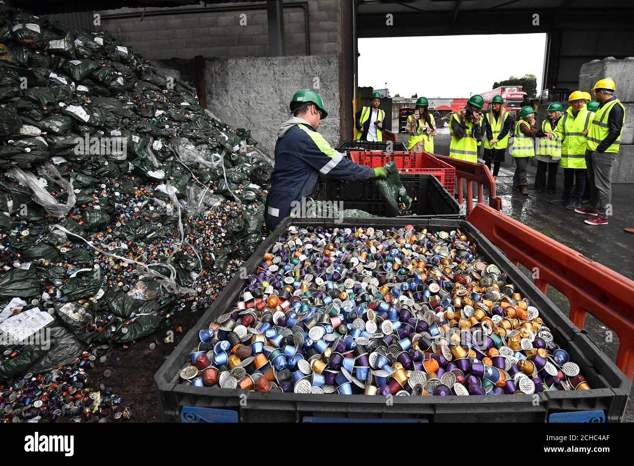 EDITORIAL USE ONLY Visitors are shown how Nespresso recycle the used