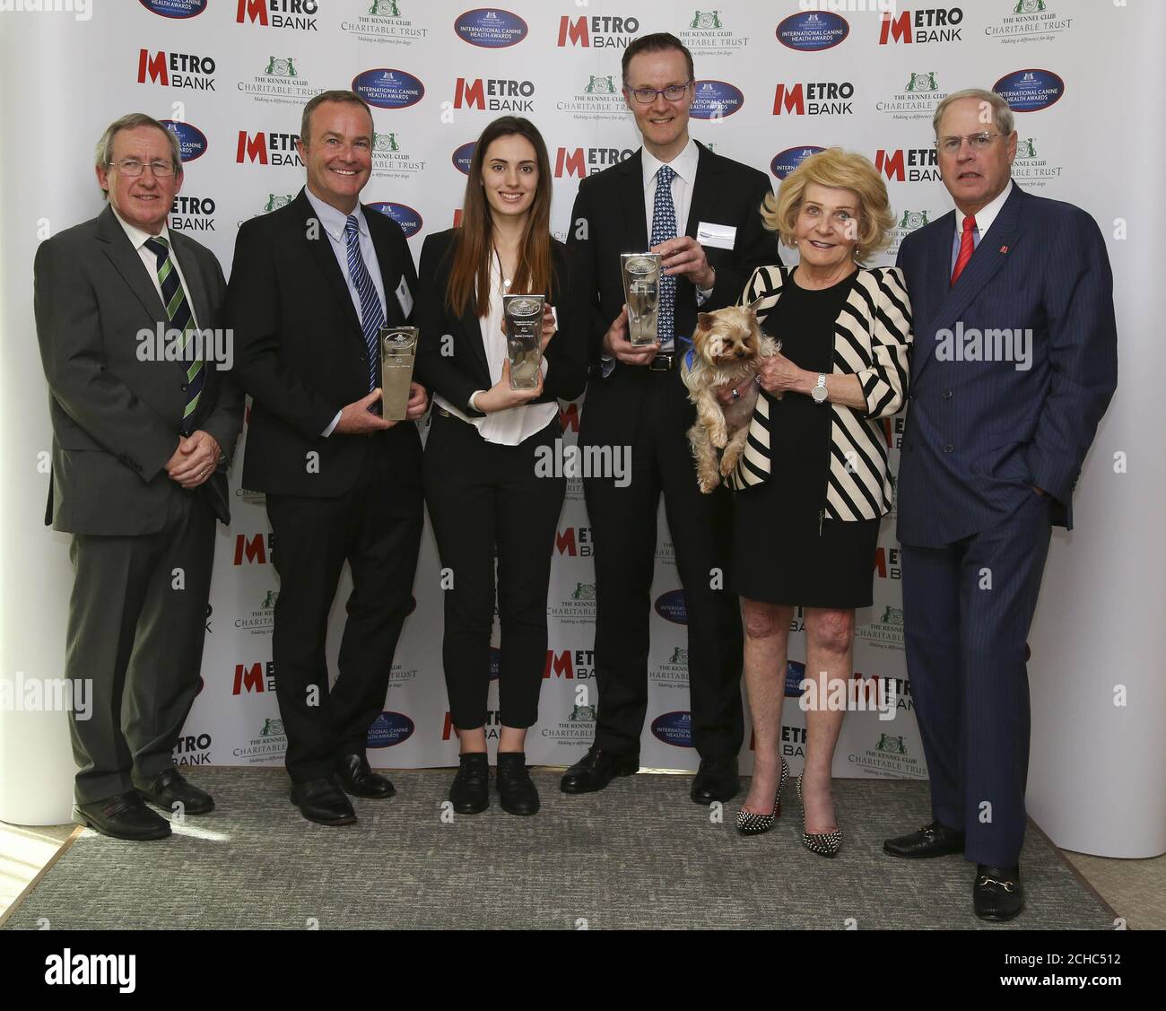 EDITORIAL USE ONLY (Left to right) Professor Steve Dean, Professor Paul McGreevy, who received the Lifetime Achievement award, Harriet Davenport, who received the Undergraduate Student Inspiration award and Professor Oliver Garden, who received the International award, with Metro Bank founder Vernon Hill (far right) his wife Shirley and their dog Sir Duffield during the Kennel Club's International Canine Health Awards 2017 at The Kennel Club, London.  Stock Photo