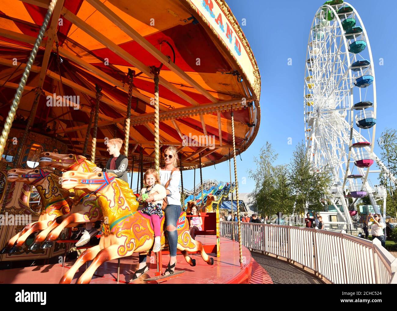Elaine Smith and her daughter Esme, from Margate, enjoy the Gallopers ...