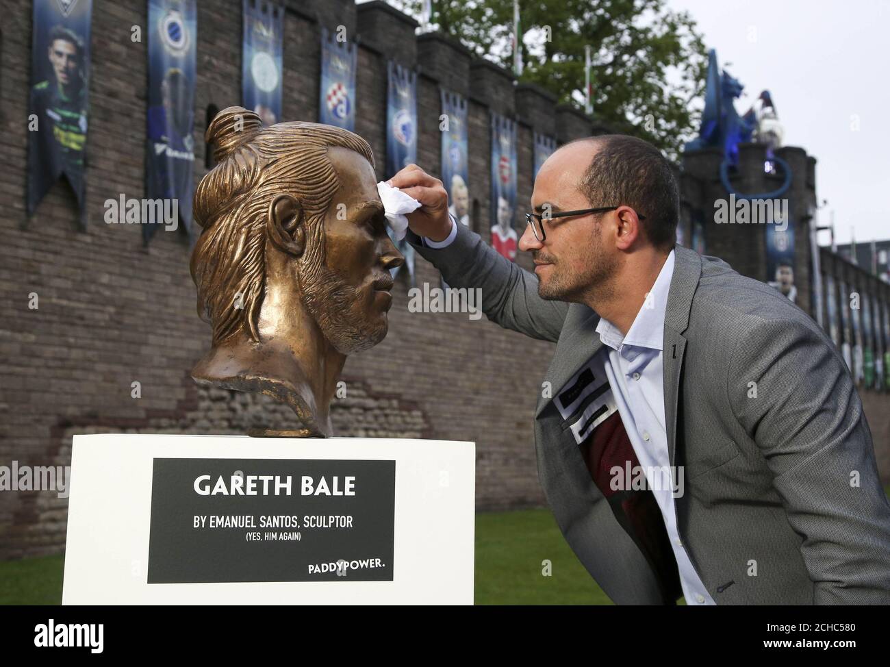 EDITORIAL USE ONLY Artist Emanuel Santos, the man behind the infamous  Cristiano Ronaldo bust, unveils a bust of Real Madrid footballer Gareth  Bale in front of the National Stadium of Wales, commissioned