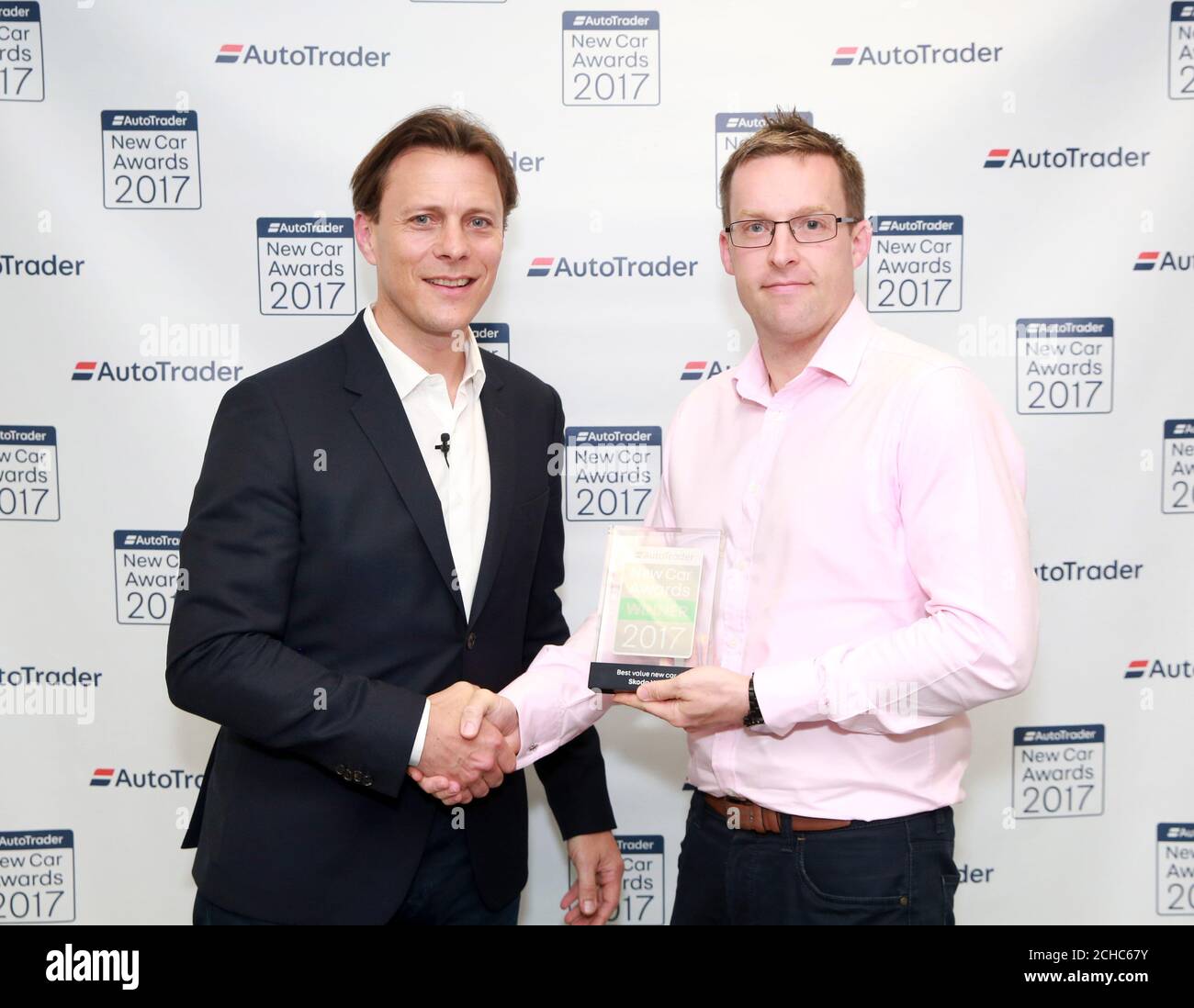 EDITORIAL USE ONLY Graeme Lambert of Skoda (right) receives the 