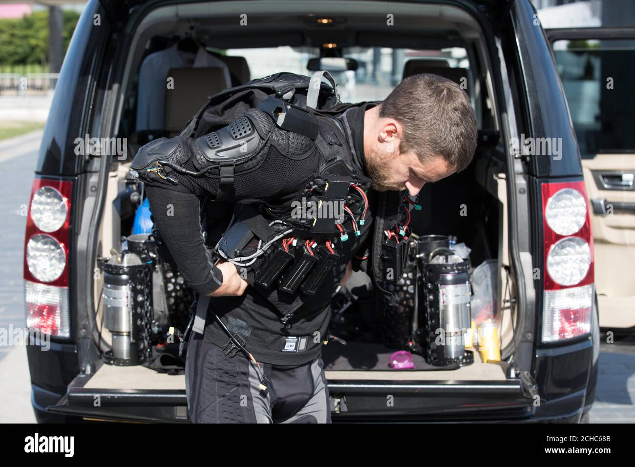 EDITORIAL USE ONLY British inventor Richard Browning, known as the &acirc;€˜Real-life Iron Man&acirc;€™, demonstrates his jet-powered flight suit as part of London Tech Week in Victoria Dock Square, London.  Stock Photo