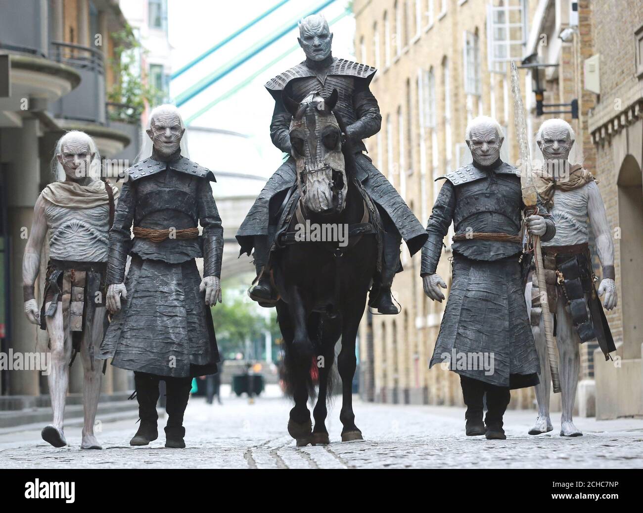EDITORIAL USE ONLY Five models dressed as &Ocirc;White Walkers&Otilde; from Game of Thrones, led by the &Ocirc;Night King&Otilde; on horseback, pass by Tower Bridge in London to celebrate the upcoming start of season 7 of the television show, which airs at 9pm on Monday July 17th on Sky Atlantic.  Stock Photo