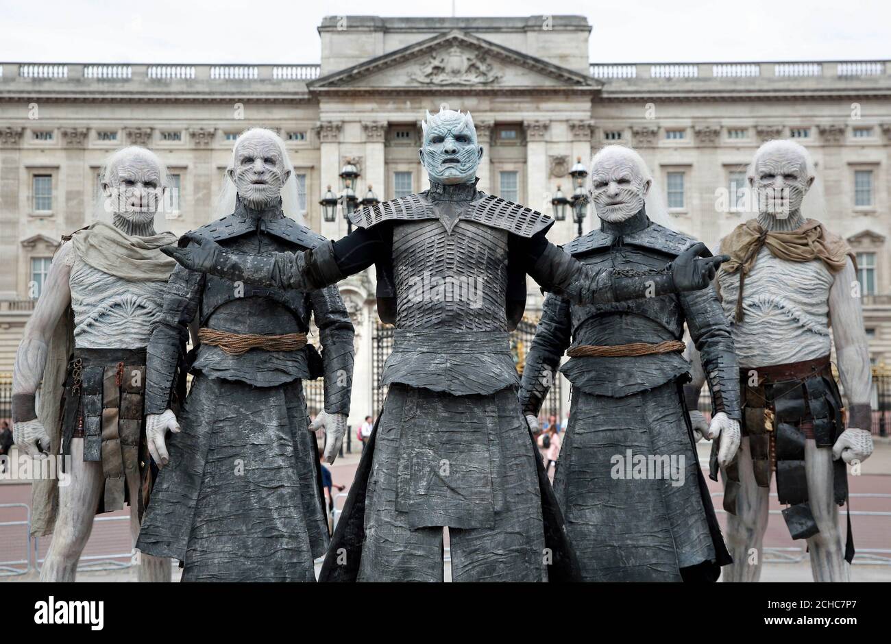 Five models dressed as White Walkers from Game of Thrones, led by the Night King, pass by Buckingham Palace in London to celebrate the upcoming start of season 7 of the television show, which airs at 9pm on Monday July 17th on Sky Atlantic. Stock Photo