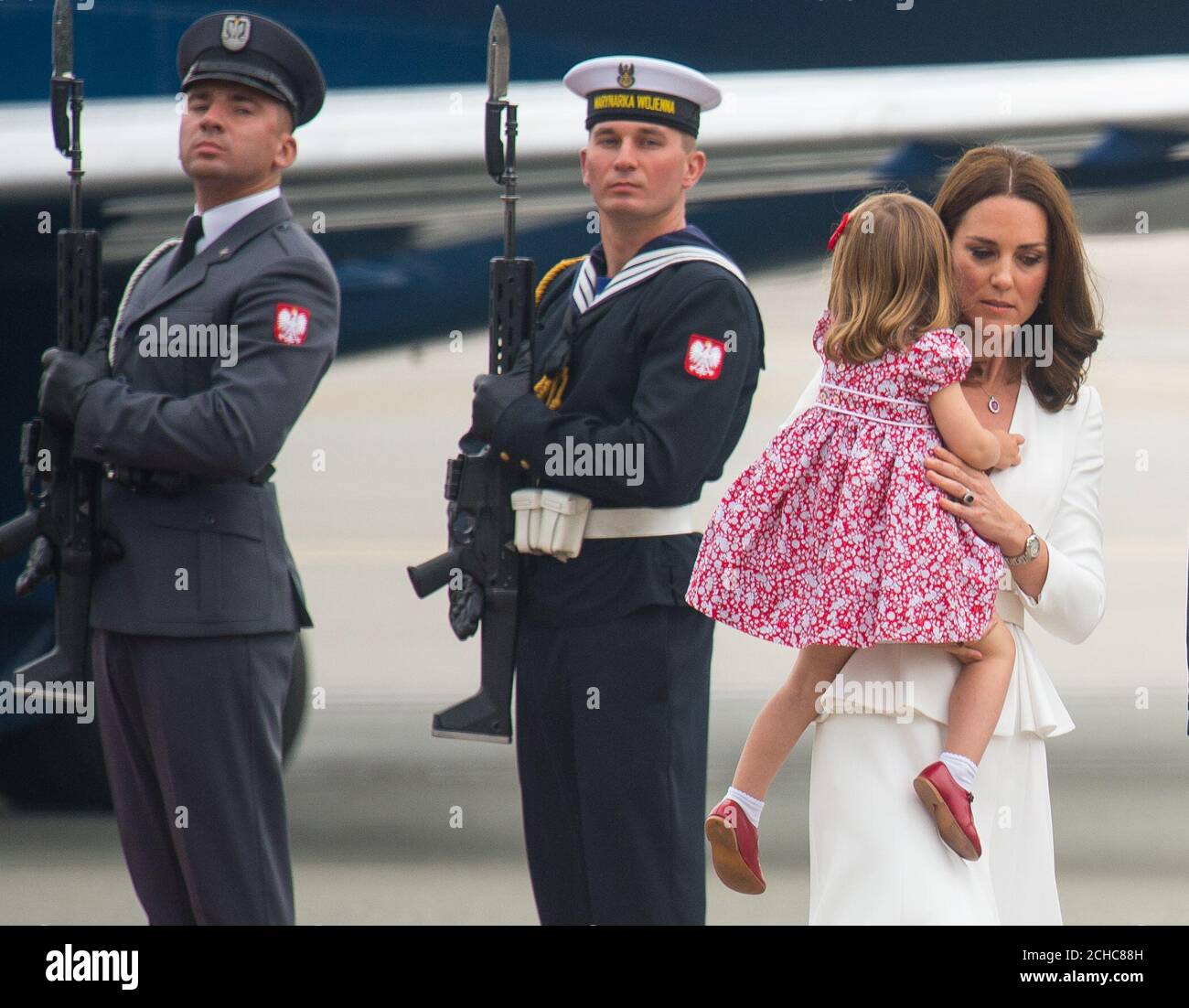 The Duchess of Cambridge and Princess Charlotte arrive at Warsaw Chopin airport, on day one of their five-day tour of Poland and Germany. PRESS ASSOCIATION Photo. Picture date: Monday July 17, 2017. See PA story ROYAL Cambridge. Photo credit should read: Dominic Lipinski/PA Wire Stock Photo