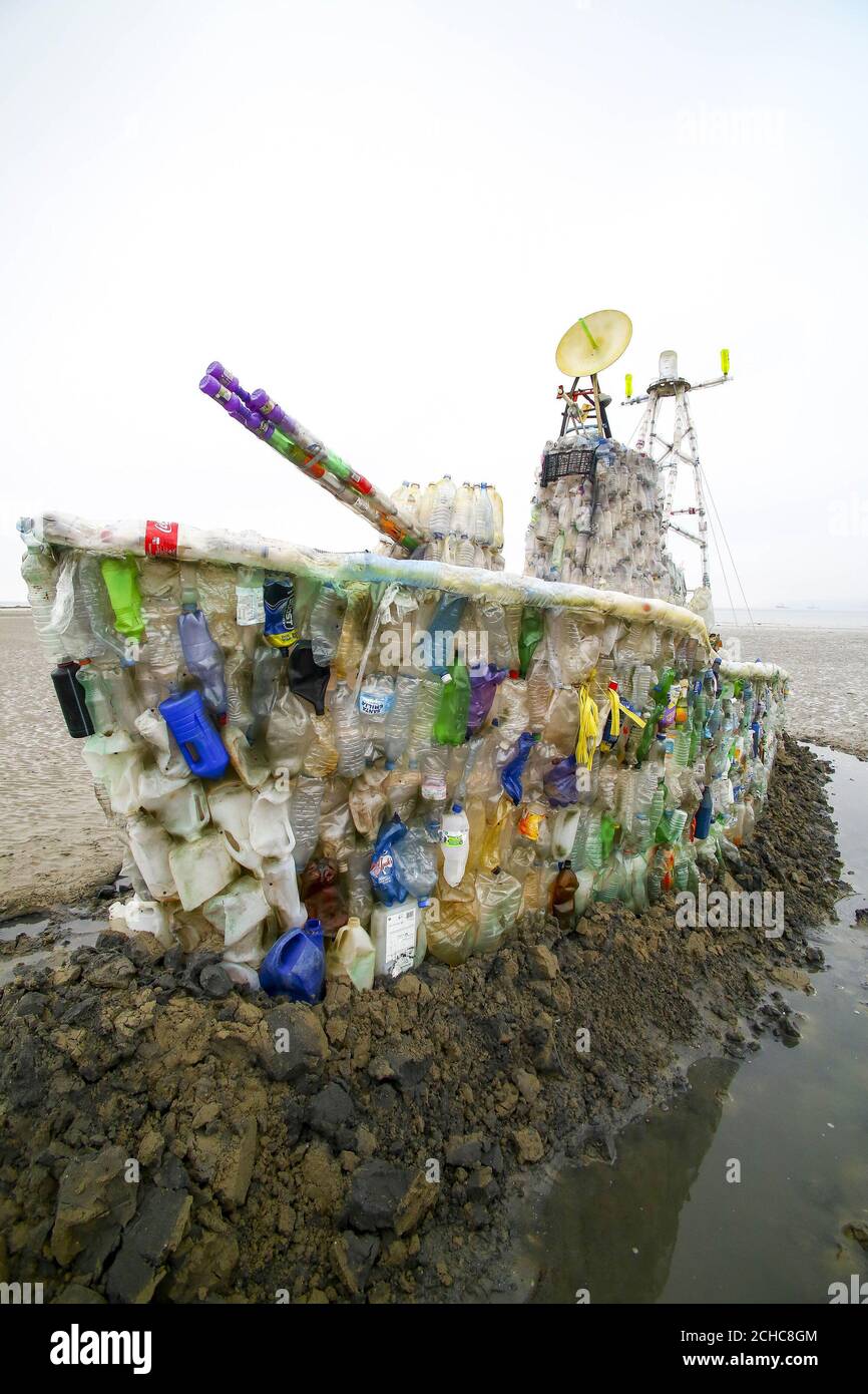 EDITORIAL USE ONLY A 30ft model of a warship, which is made entirely of plastic marine litter is unveiled on Marazion Beach in Cornwall by campaign group Surfers Against Sewage, to highlight the growing threat of throwaway plastic in the seas and encourage the public to reduce their single-use plastic footprint. Stock Photo