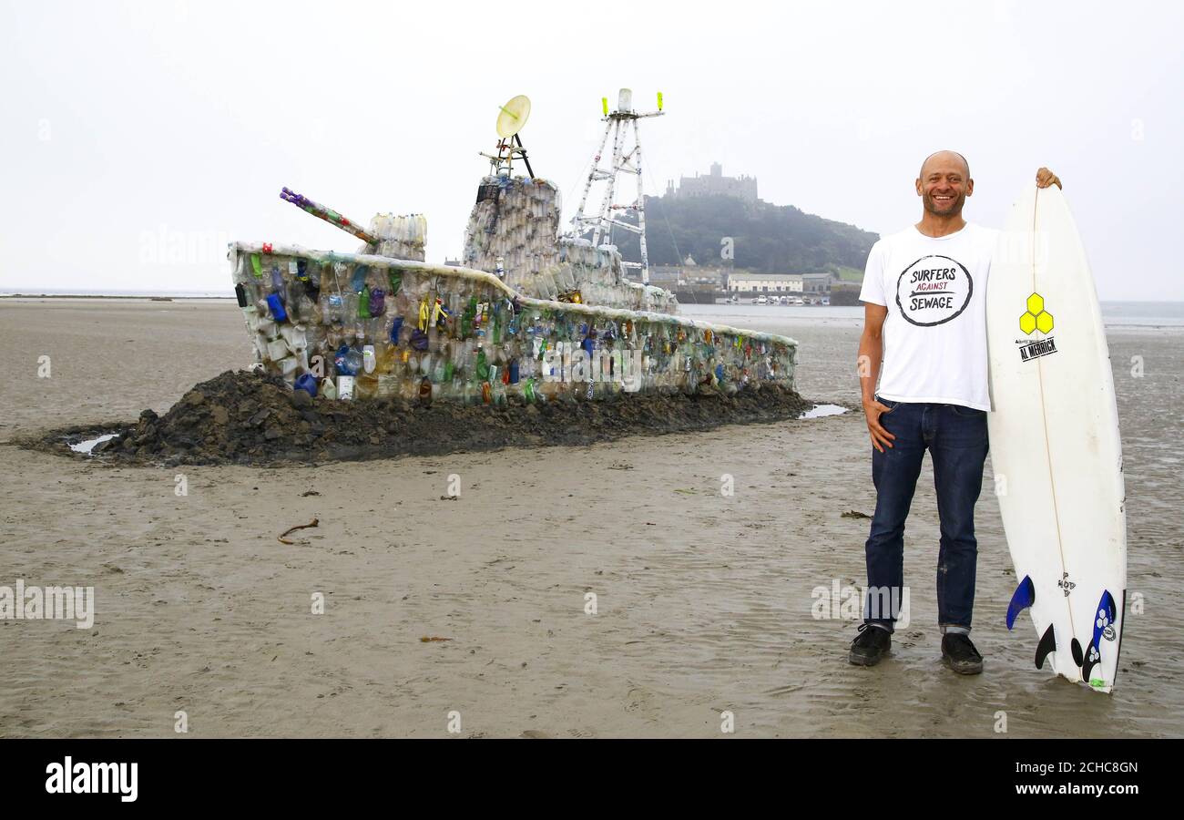 EDITORIAL USE ONLY Hugo Tagholm, CEO Surfers Against Sewage, unveils a 30ft  model of a warship, which is made entirely of plastic marine litter is  unveiled on Marazion Beach in Cornwall by