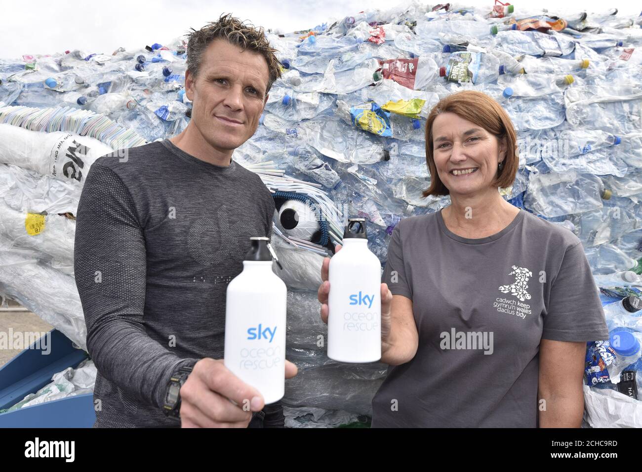 EDITORIAL USE ONLY Double Olympic gold medalist rower James Cracknell with Keep Wales Tidy Chief Executive Lesley Jones join Sky Ocean Rescue to unveil a 10-metre long whale in Cardiff Bay, Wales, which is made entirely from recycled plastic recovered from the ocean, beach cleans and local reCycling plants to raise awareness of the issue of ocean health. Stock Photo