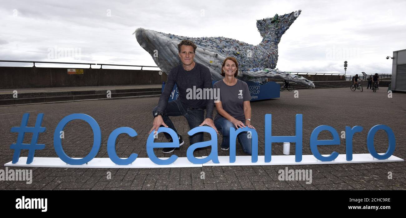 EDITORIAL USE ONLY Double Olympic gold medalist rower James Cracknell with Keep Wales Tidy Chief Executive Lesley Jones join Sky Ocean Rescue to unveil a 10-metre long whale in Cardiff Bay, Wales, which is made entirely from recycled plastic recovered from the ocean, beach cleans and local recycling plants to raise awareness of the issue of ocean health. Stock Photo